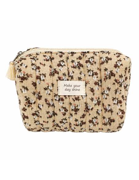 Neceser acolchado de algodón con estampado floral vintage y detalle de borla decorativa.